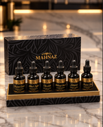 Six Rancho Mahnaz concentrates in their black and gold gift box