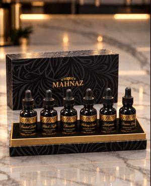 Six Rancho Mahnaz concentrates in their black and gold gift box