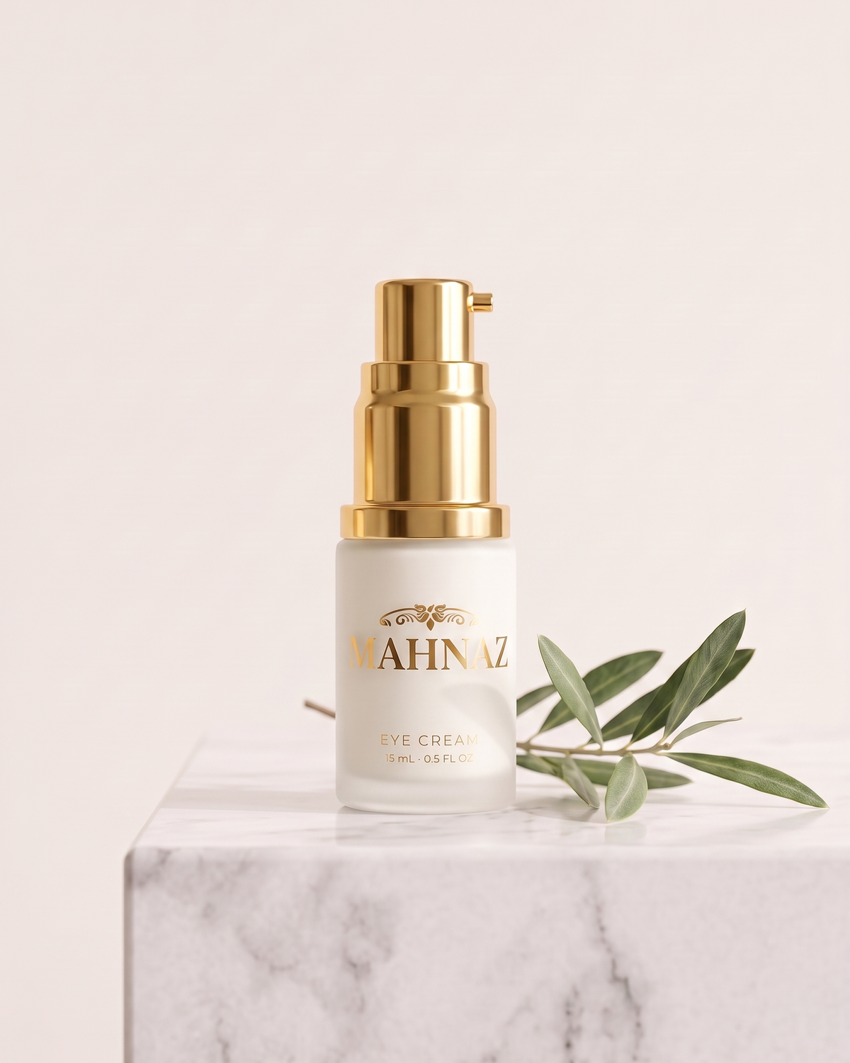 Mahnaz Eye Cream in a clear glass bottle with a gold pump