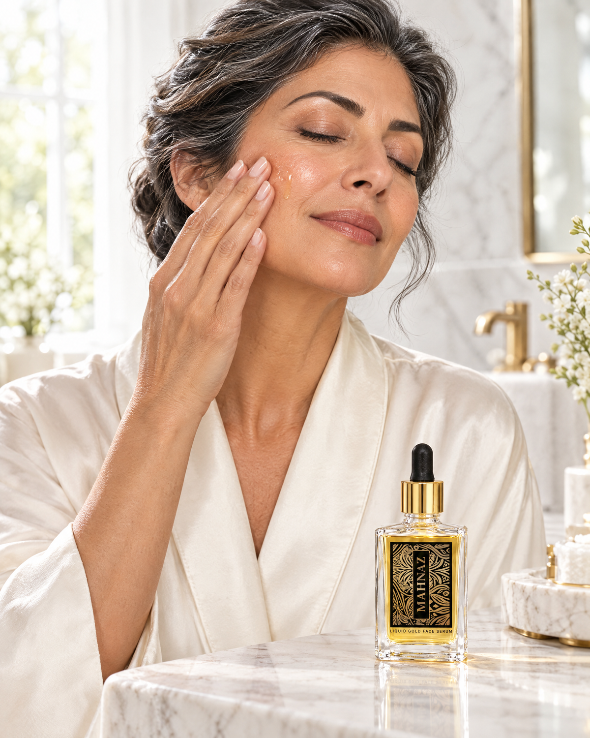 A woman pressing a few drops of Liquid Gold Face Serum into her cheek