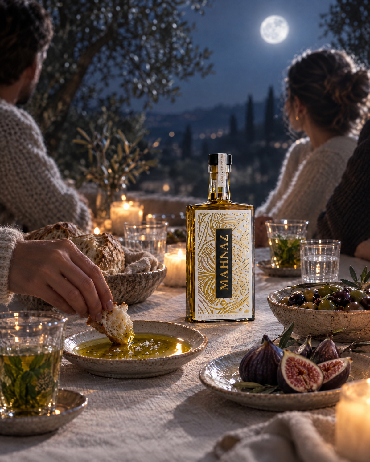 A quiet dinner on a terrace under a full moon, bread dipped in Sous La Lune